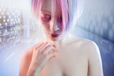 a young girl with pink eyes and hair, like a dollの写真素材