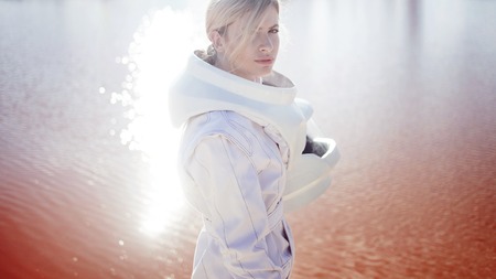 futuristic astronaut on another planet, sandy red planetの写真素材