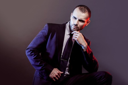 serious man in a business suit, darkの写真素材