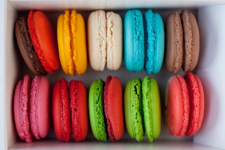 Colorful macaroons tower close-up on the white background.の写真素材