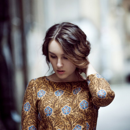 beautiful smiling girl in the street, portrait, close-upの写真素材