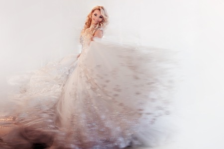 Beautiful girl bride in a magnificent dress.の写真素材