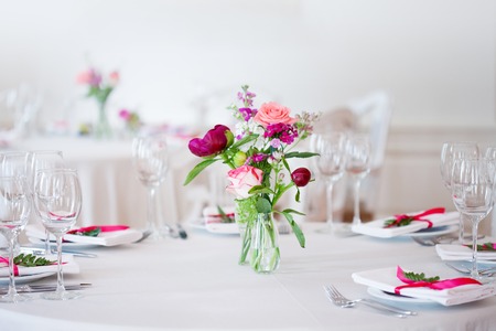 Wedding banquet, small restaurant floral, decor in red, informal style. Details close up