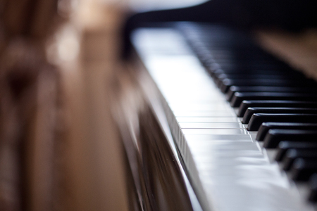 Piano keyboard background with selective focus. Color toned imageの写真素材