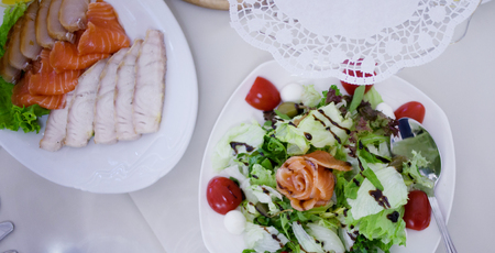 Appetizers. Various types of cheese, salami and prosciuttoの写真素材
