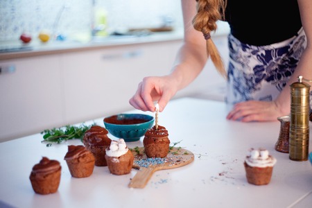 New Year celebration cupcakes, chocolate muffins on the tableの写真素材