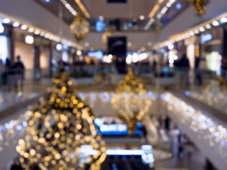 Time of a Christmas sales, shopping center, festively decorated. blurred backgroundの写真素材