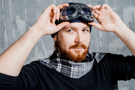 Retro Boy Pilot. Man in glasses and scarf, fantasy image of Aviatorの写真素材