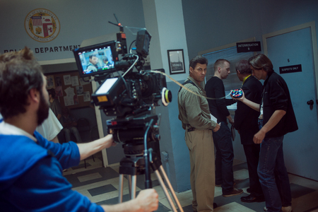 SAINT PETERSBURG, RUSSIA - AUGUST 20, 2016: Film Crew On Location. 4K Camera & Cinematographer. Filmmaking. Set, scenery police stationのeditorial素材