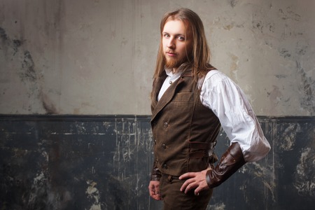 Handsome male Steam punk. Retro man portrait over grunge background.の写真素材