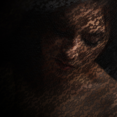 Mysterious portrait of beautiful woman in black veilの写真素材