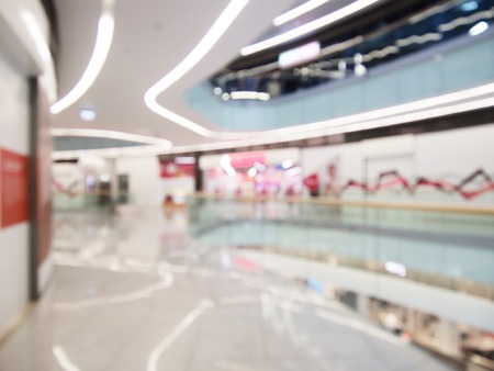 Interior of the modern building, blurred shopping mall background. Commercial or business center.