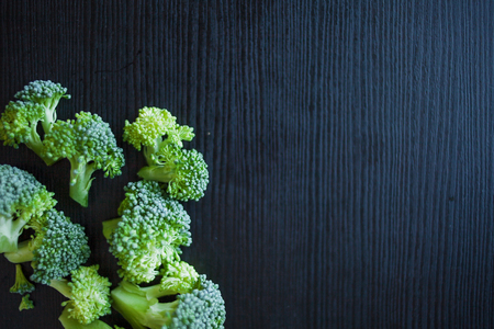 Fresh broccoli. Many green broccoli on a wooden table. Top viewの写真素材