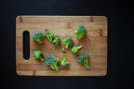 Fresh broccoli. Many green broccoli on a wooden table. Top view.の写真素材