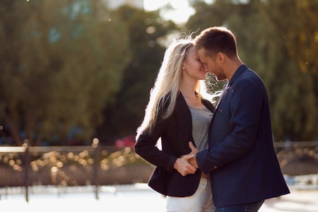 Kiss. Couple in love. Portrait of attractive happy girl and the guyの写真素材