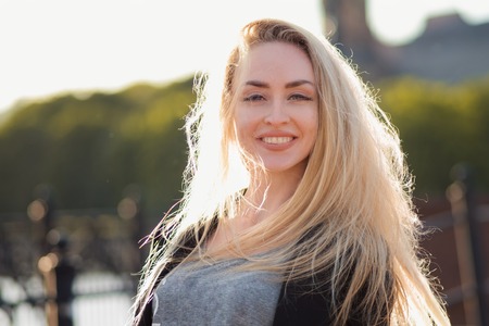 Portrait of a beautiful blonde on the street. Close-upの写真素材