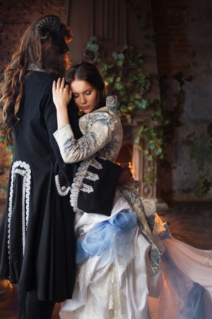 Fine art photo. Beautiful girl and a monster, danceの写真素材