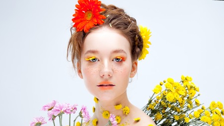 Beautiful young girl in the image of flora, close-up portraitの写真素材