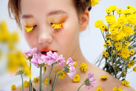 Beautiful young girl in the image of flora, close-up portraitの写真素材