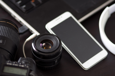 DSLR camera and a mobile phone with built-in cameraの写真素材