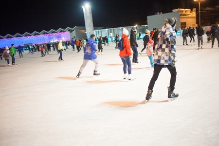 MOSCOW, RUSSIA - NOVEMBER 20, 2016: A lot of people riding on public ice rink in Sokolniki Park in Moscowのeditorial素材