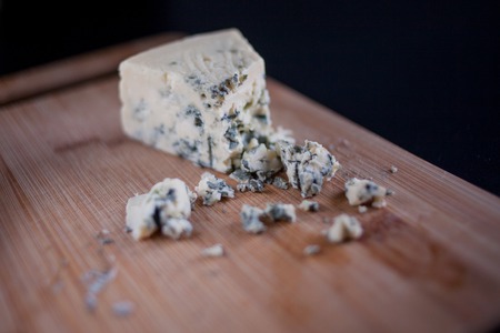Brie cheese on wooden Board, close-up, cutの写真素材