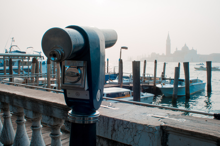 VENICE, ITALY - OCTOBER 6 , 2017: Binoculars coin-operated on Saint Mark square with San Giorgio di Maggiore church on the backgroundのeditorial素材