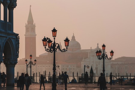 VENICE, ITALY - OCTOBER 6 , 2017: Morning Piazza San Marco, tourists walk on square