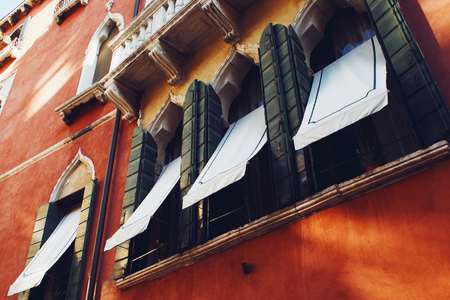 Italian Gothic window with wooden shuttersの写真素材