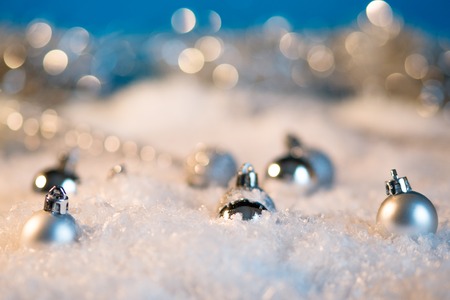 Christmas ball on the snow festive backgroundの写真素材
