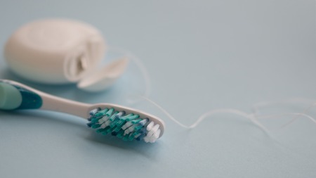 Floss and brush. Set for brushing teeth.の写真素材