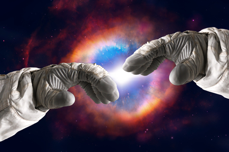 Close up of human hands touching with fingers in spaceの写真素材