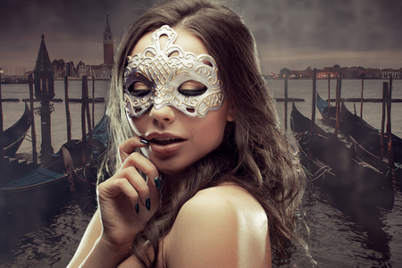 Young and beautiful woman on Venetian view background, gondolas.の写真素材