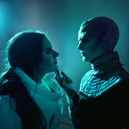 Woman and an alien look at each other. Contact with other civilizations. Toningの写真素材