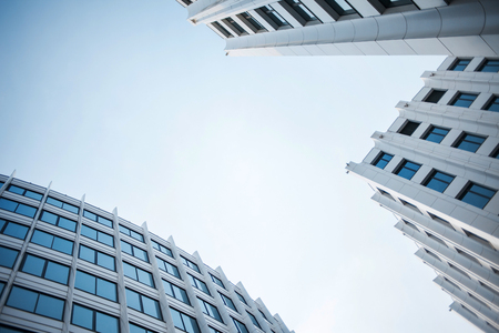 facade of white buildings in the business quarter. Not fully glass facades. Perspective, direction forwardの写真素材