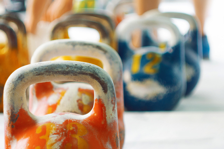 Multicolor kettlebells on gym. Close up. Work out with the kettlebellsの写真素材