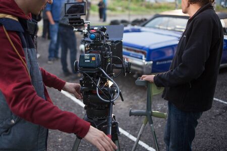 SAINT PETERSBURG, RUSSIA - OCTOBER 31, 2018: Film Crew On Location. 4K Camera Cinematographer. Filmmaking Set sceneryのeditorial素材