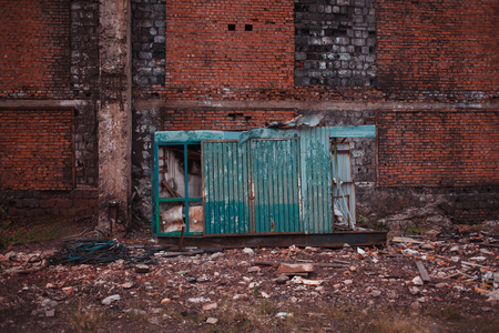 Abandoned grunge place, textured brick wall, ruins and garbageの写真素材