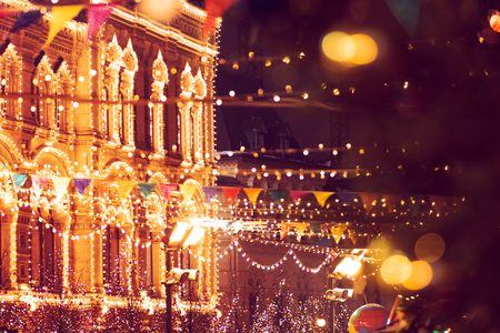 New year's fair on red square in Moscow. Festive decor. Christmas decoration. Christmas toys on the background of a shining Gumの写真素材