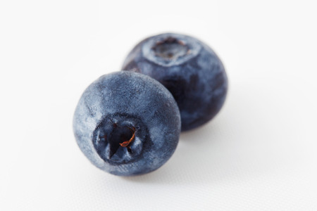 Fresh blueberry isolated on white. Two berries on a white backgroundの写真素材