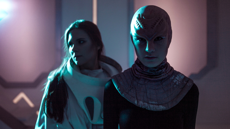 Woman and an alien look at each other. Contact with other civilizations. Toningの写真素材