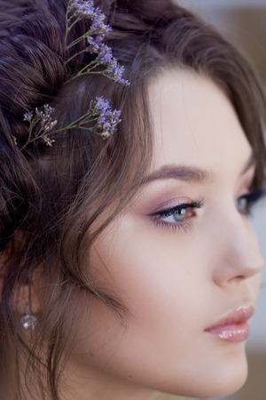 Stylist makeup artist doing makeup and hair in a beauty salon. Professional make-up, master of image...