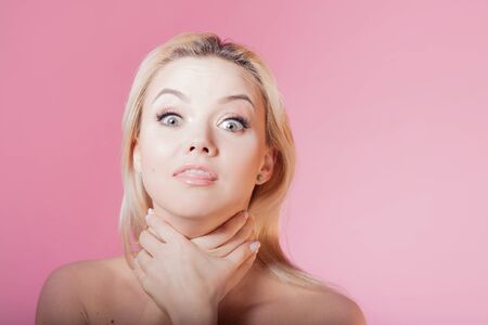 Annoyed girl. Beautiful young woman tired of cosmetics and beauty standards. Grimace breath and...