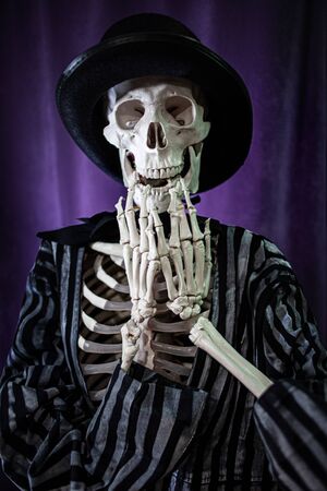 surprised skeleton in a striped suit and top hat. Halloween Is Comingの写真素材