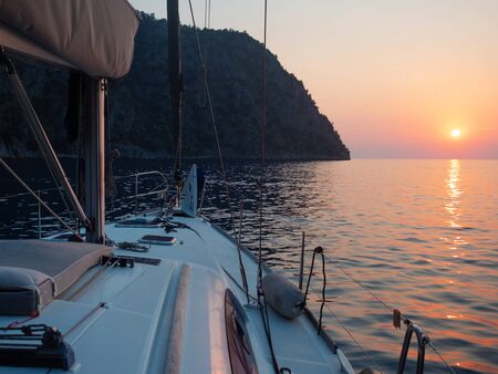 Meet the sunset in the Bay on Board the yacht, a romantic evening at sea. Boat trip on a yacht under...