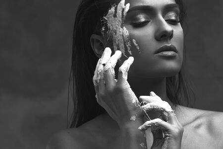 Beautiful young woman, emotional black and white portraitの写真素材
