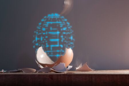 An eggshell and a hologram of an entire egg. The cyberpunk concept. Life extension science, digital...
