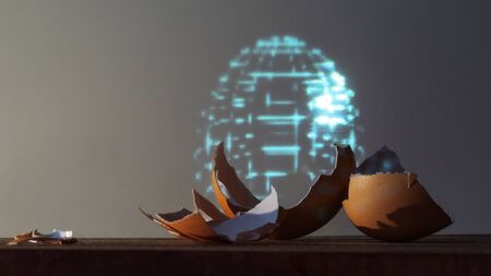An eggshell and a hologram of an entire egg. The cyberpunk concept. Life extension science, digital immortalityの写真素材