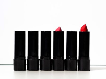 set of six multi-colored lipsticks or lip glosses. set of makeup artist, beauty and cosmetics for every day, white backgroundの写真素材