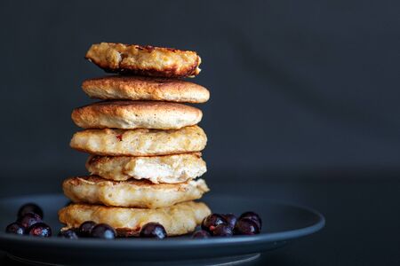 Oatmeal pancakes, homemade Breakfast pastries, dark backgroundの写真素材